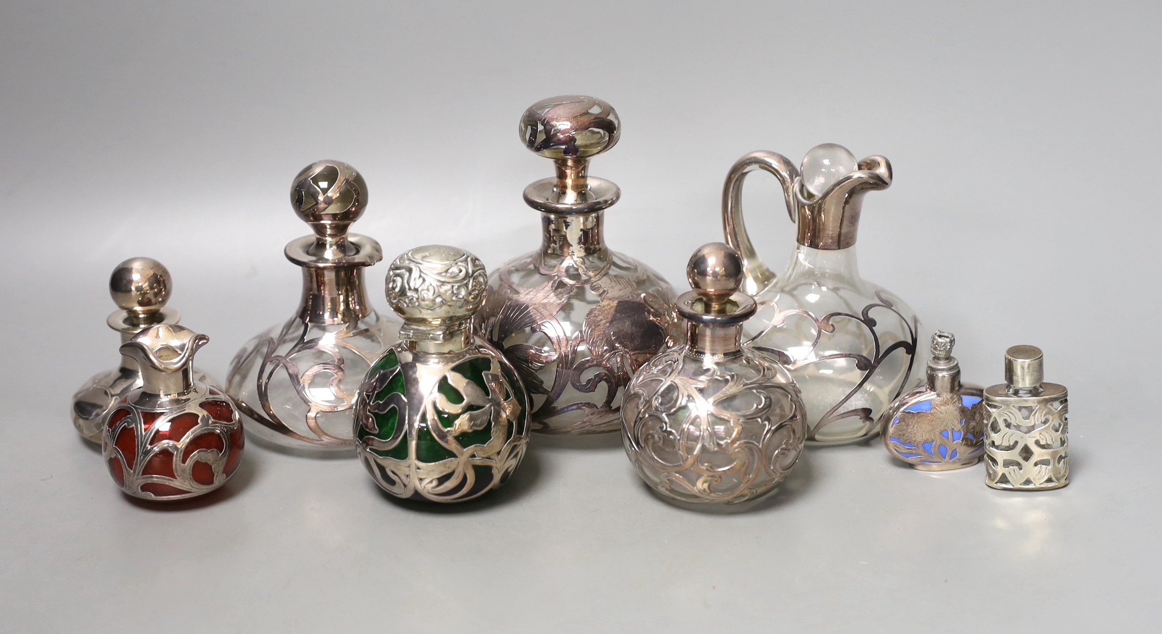 A group of white metal jacketed scent bottles, jugs etc (group)